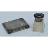 A George V hallmarked silver and tortoiseshell topped small cut glass square shaped scent bottle