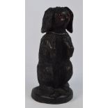 A decorative carved wooden model of a seated spaniel, height 52cm.