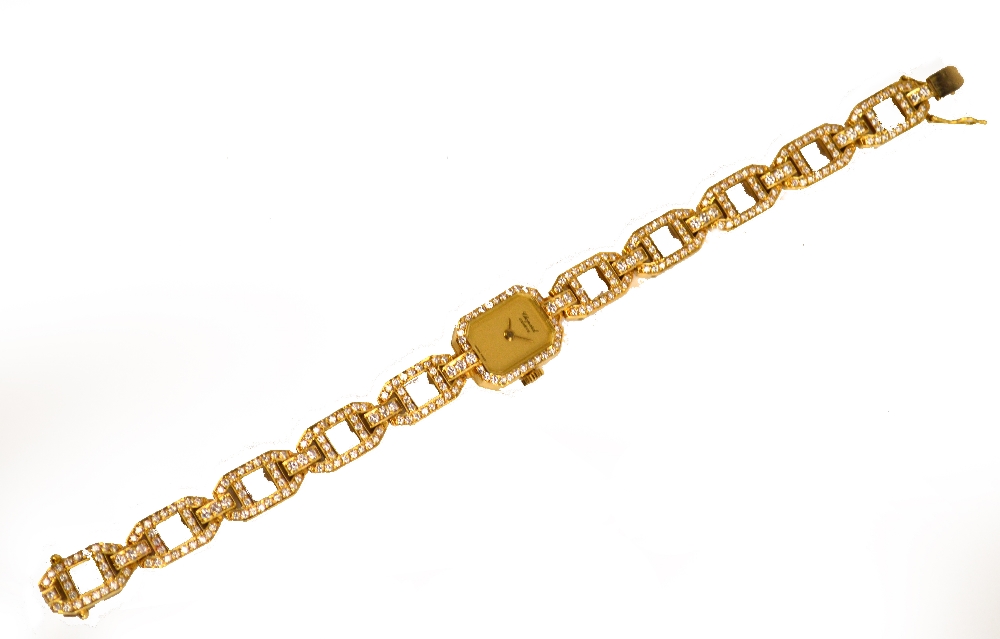 CHOPARD; a lady's 18ct gold diamond set wrist watch, the rectangular dial with canted corners,