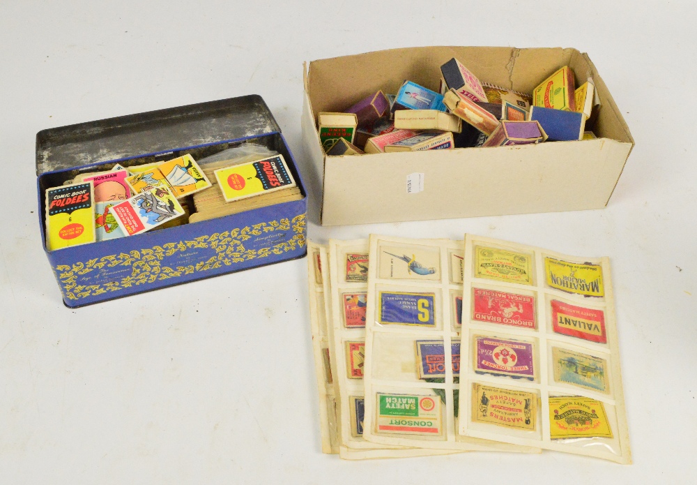 A box of matchbox covers and football cards.