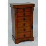 A late Victorian oak six drawer Wellington chest with moulded top, side locking arm and bracket