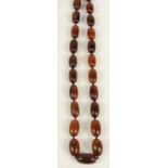 A rhino horn graduated oblong bead necklace, length 90cm, approx 99g. CONDITION REPORT: Largest bead