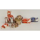 A group of nine Royal Crown Derby paperweights; two modelled as sleeping kittens, two as seated