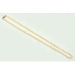 A cultured pearl necklace with 9ct gold clasp set with single pearl, length 60cm,