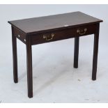 A George III mahogany two drawer foldover tea table raised on square section legs.