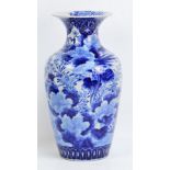 A large Japanese Meiji period blue and white vase decorated with birds amongst floral branches,