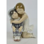 A Lladro figure group of a ballerina embracing a harlequin, height 30cm. CONDITION REPORT: Appears