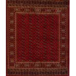 A red ground Bokhara carpet, 230 x 160cm.