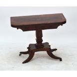 An early 19th century mahogany crossbanded foldover card table on square section baluster column to