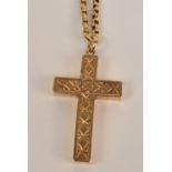 A yellow metal cross pendant engraved to both sides, on yellow metal open link chain necklace.