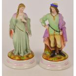 A pair of decorative Continental Parian figural lamp bases in the form of a man and woman in