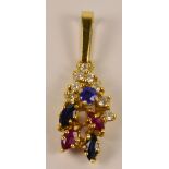 A yellow metal diamond, sapphire and ruby pendant with shaped drop,