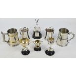 A group of electroplated golfing trophies comprising four mugs with presentation inscriptions,
