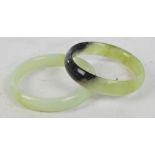 Two jade bangles, diameter 8cm and 7.5cm.