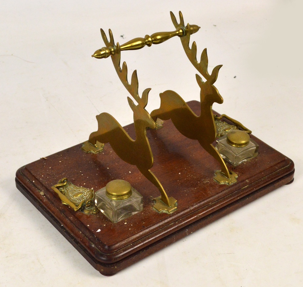 A late Victorian mahogany and brass mounted inkstand,