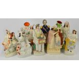 Eight large late 19th century and reproduction Staffordshire figures including two spill vases.