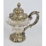 An early 19th century Continental (probably German) ornate glass mustard pot with plated mounts,