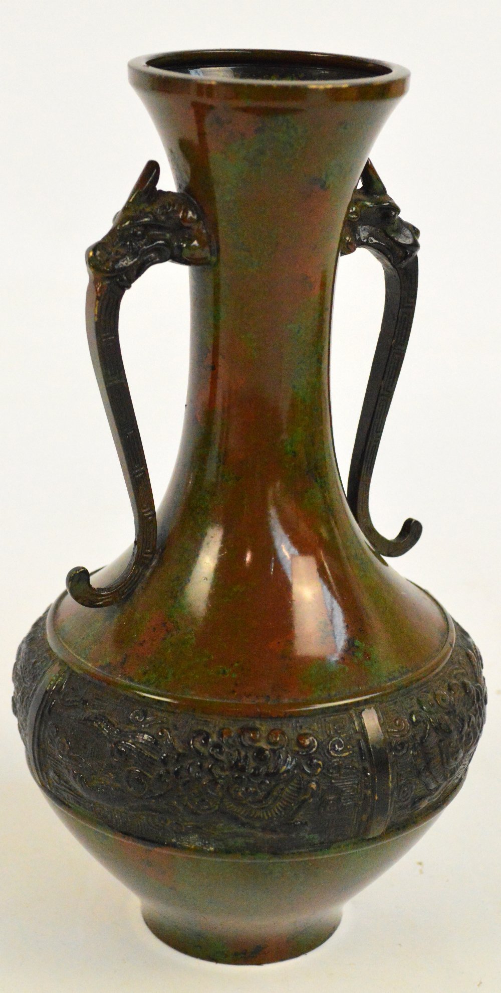 An early 20th century Japanese green and brown painted bronze bottle vase,