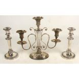 A silver plated twin branch three light candelabrum with central lyre shaped stem and spreading