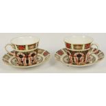 A pair of Royal Crown Derby Imari decorated 1128 pattern cups and saucers (all seconds),