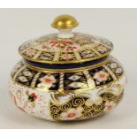 A ROYAL CROWN DERBY TIFFANY & CO.; a circular box and cover, printed marks to base and inscribed "