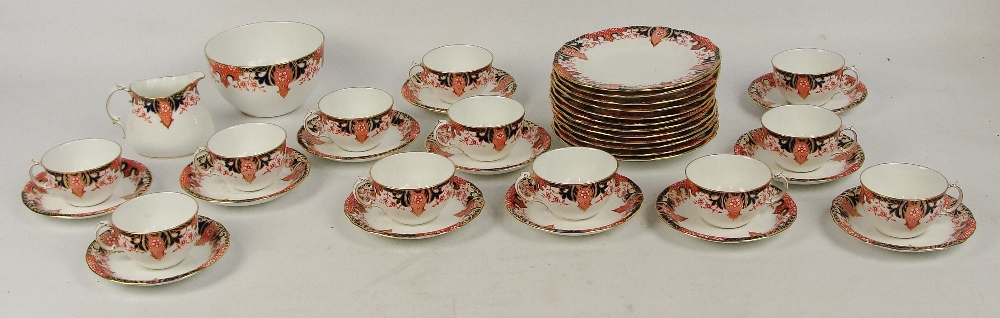 A Royal Crown Derby tea service, comprising twelve cups, twelve saucers, twelve side plates, sugar