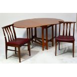 A 1970s teak dropleaf dining table with four stick back chairs with padded and square section