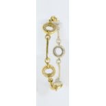 BOODLES; an 18ct yellow gold diamond set bracelet, the frame set with four diamond set roundels