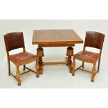 An oak drawleaf table and four chairs (5).