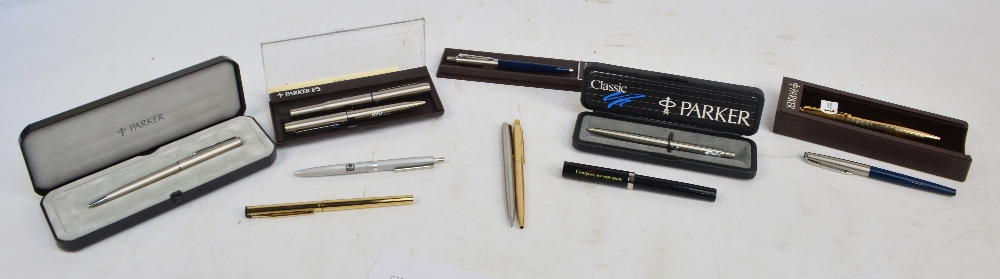 A collection of eight Parker ball pens including two gold plated examples and a Parker propelling