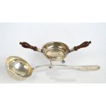 A white metal ladle with hammered bowl and flattened fiddle pattern shaped finial with monogram,