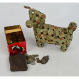 A very unusual dog made from cut and folded packets of Will's Cigarettes, also a quantity of coins.