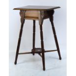 An Edwardian walnut side table.