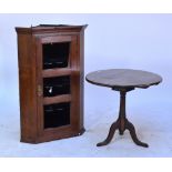 A 19th century oak circular occasional table, and an oak flat fronted corner cupboard (2).