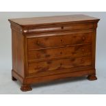 A three drawer commode with plank top and ogee bracket feet.