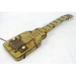 A vintage Krafsman six string steel guitar with simulated wooden case, length 80cm.