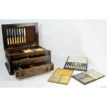 A 1920s oak part fitted canteen of cutlery, two cased sets of six fruit knives,