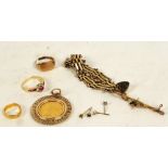 A Victoria sovereign, 1884, young head, in 9ct gold pendant mount, a 9ct gold bracelet,