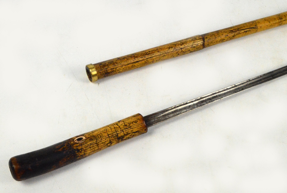 A late 19th century bamboo swordstick with etched blade to both sides, length 93cm. CONDITION