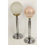 Two French Art Deco style chromed table lamps with globular shades, height 60cm and 55cm.