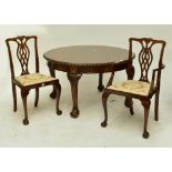 An Edwardian mahogany circular extending dining table with rope twist border, two broad additional