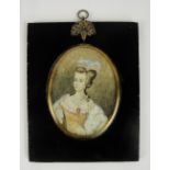 A decorative gouache on ivory portrait miniature, signed "Jean Baptiste" lower left,