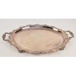 A large oval twin handled plated tray with scrolling foliate edge and design centred on a Star of
