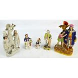 Five late Victorian Staffordshire figures including three spill vases, largest height 31.5cm,