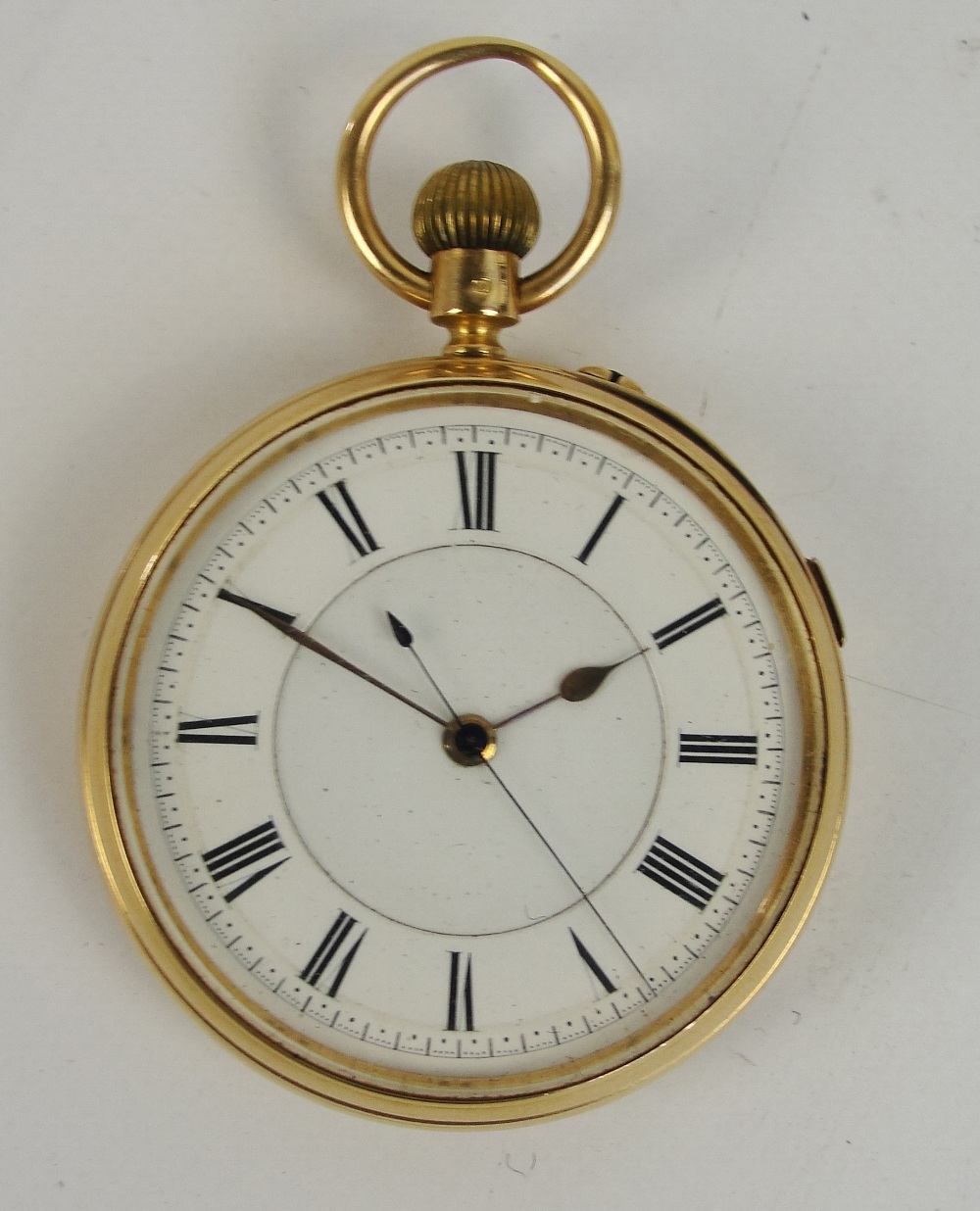 An 18ct yellow open face crown wind pocket watch, the circular enamel dial set with Roman numerals,
