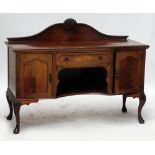 An Edwardian mahogany sideboard.