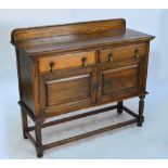 An early 20th century oak sideboard with two drawers and two cupboard doors, width 123cm.
