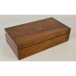 A 19th century rosewood and brass strung writing slope with central vacant shield shaped cartouche,