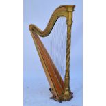 A 19th century Gothic style double action harp by Erard with wrythen column and decorated in