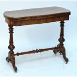 A good quality Victorian burr walnut card table of serpentine outline raised on turned end supports